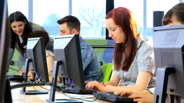 Teacher and classmates working on modern IT application — Stock Video