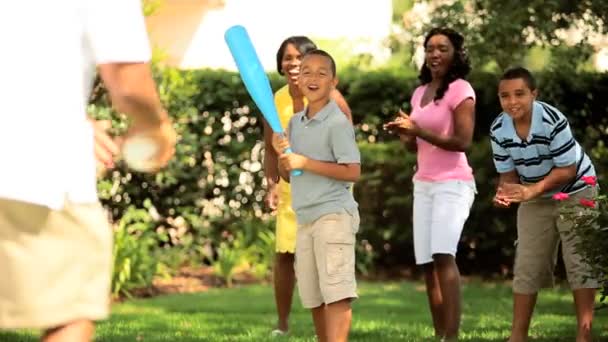 Ethnic happy family playing baseball on vacation — Stock Video