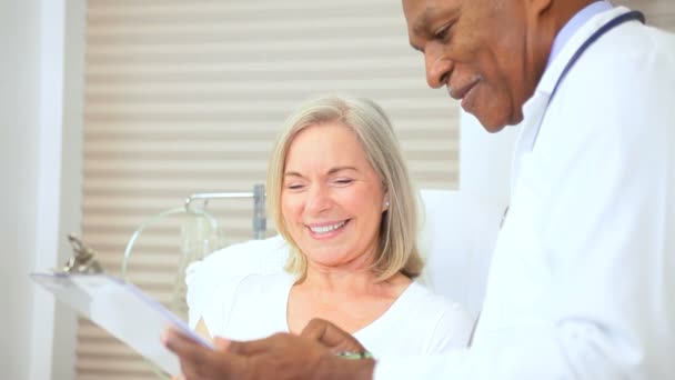 Doctor Treating Senior Female Patient — Stock Video