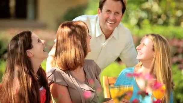 Young Family Talking Together Front garden — Stock Video