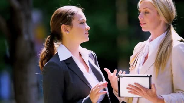 Young businesswomen using tablet — Stock Video