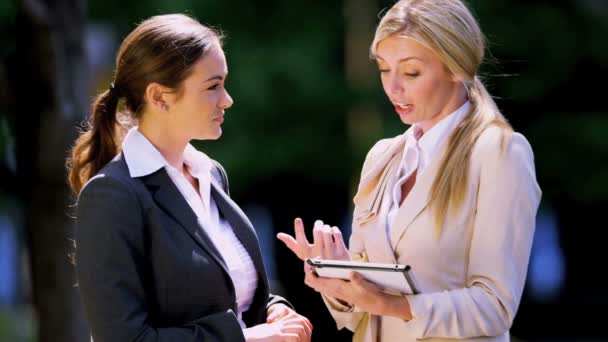 Young businesswomen using tablet — Stock Video