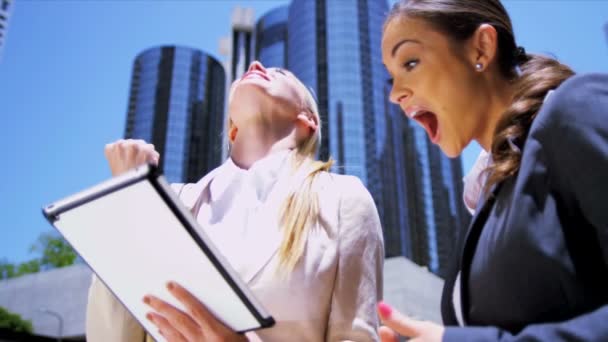 Female businesswomen using wireless tablet — Stock Video