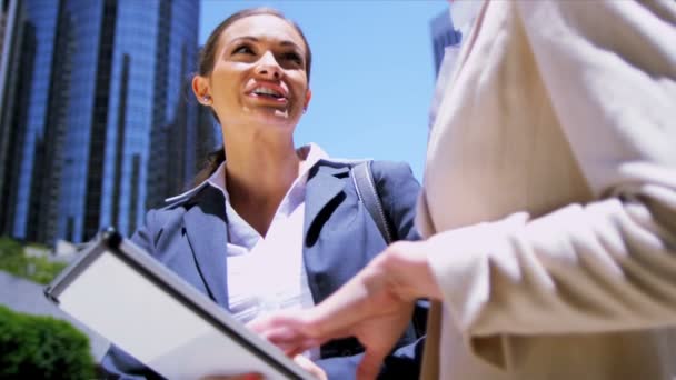 Female businesswomen using wireless tablet — Stock Video