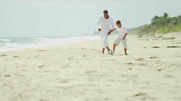 African American father son playing soccer — Stock Video