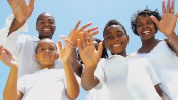 Ethnic sons and daughter with parents waving on video postcard — Stock Video