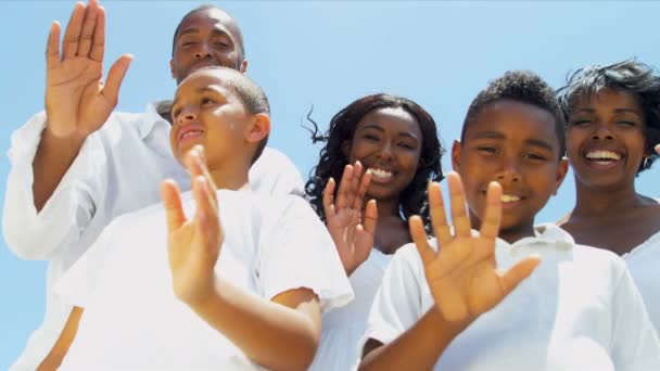 Close up of ethnic young children and parents waving on video call — Stock Video