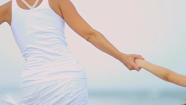 Caucasian mother and daughter having fun holiday together on beach — Stock Video