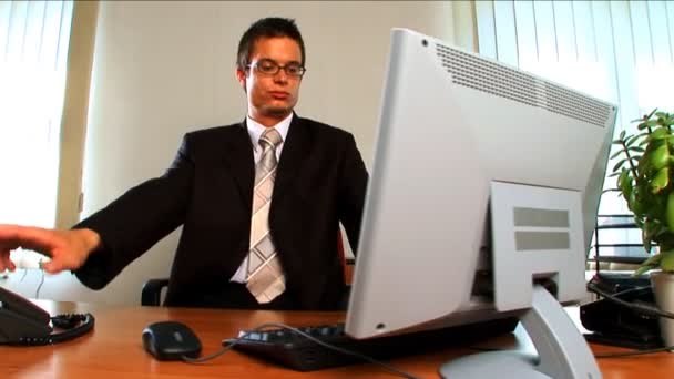 Young businessman in modern working environment — Stock Video