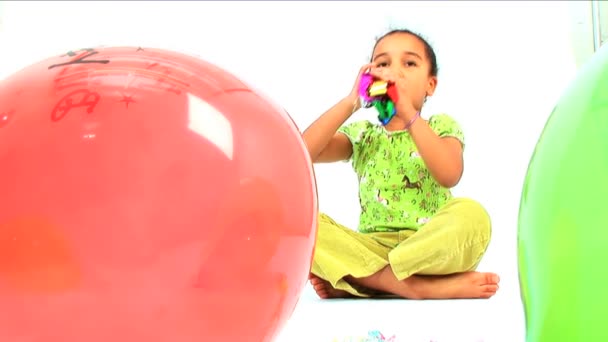 Cute little african american girl playing with party toys & balloons — Stock Video