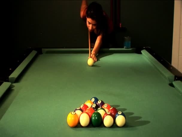 Beautiful latino girl making the break of the balls on a pool table — Stock Video