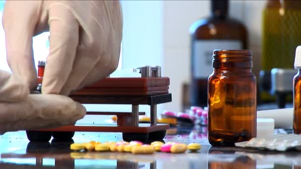 Healthcare medicines & tablets being prepared in a pharmacy — Stock Video