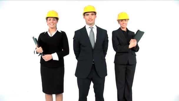 Equipo de arquitecto de construcción posando aislado sobre blanco — Vídeos de Stock