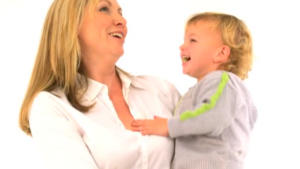 Beautiful young mother and her cute little son singing together — Stock Video