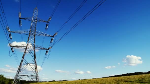 Electricity pylons time-lapse with clouds and blue sky — Stock Video