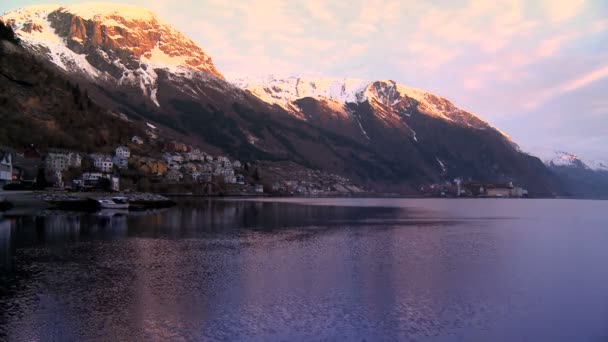Time-lapse of hillside community & oil refinery beside glacial fjord — Stock Video