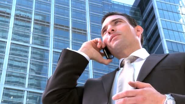 Ambitious young city businessman working on a mobile(cell) phone — Stock Video