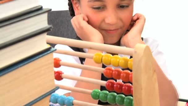 Cute african american schoolgirl early learning counting with an abacus — Stock Video