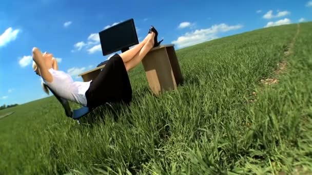 Young businesswoman in environmental workplace daydreaming of a brighter future — Stock Video