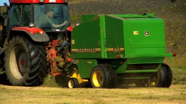 Farmer baling the harvested crop — Stock Video