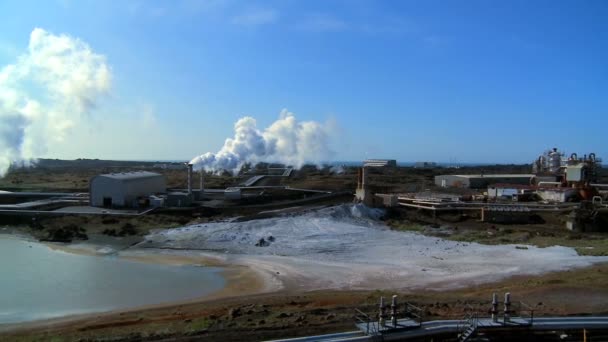 Steam from geothermal energy being piped from natural volcanic hot springs — Stock Video