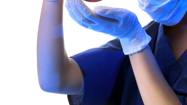 Close up of female scientist examines vial with blood — Stock Video