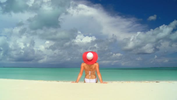 Serene young female sunbathing & dreaming under tropical clouds — Stock Video