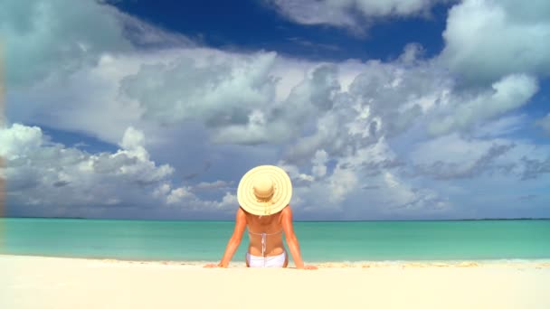 Serene young female sunbathing & dreaming under tropical clouds — Stock Video