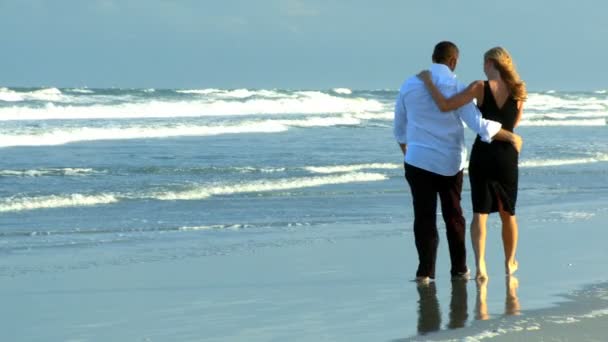 Two young in love having fun on the beach early morning after a social night out — Stock Video