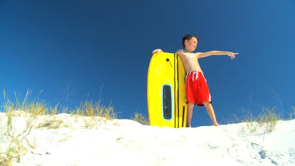 Young Boy With Bodyboard — Stock Video