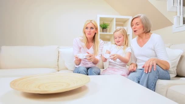 Child Playing on Games Console with Family — Stock Video