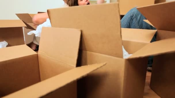 Caucasian Couple Surrounded by Moving Boxes — Wideo stockowe