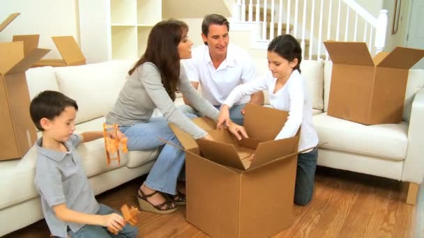 Family Packing up Cardboard Moving Cartons — Stock Video