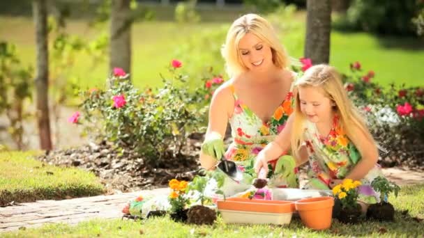 Blonde Mom  Daughter Gardening Together