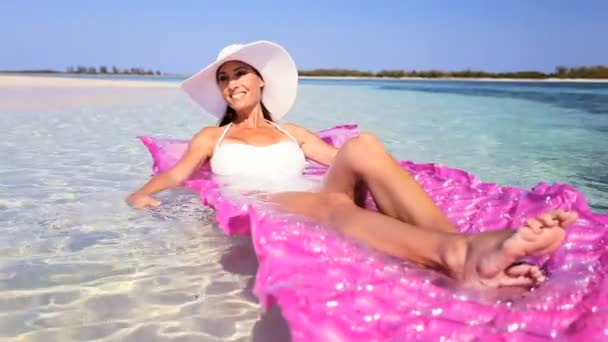 Elegant Female Floating on Air Mattress — Stock Video