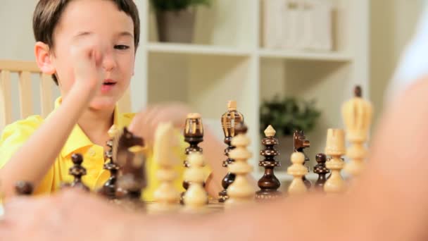 Young Caucasian Boy Playing Chess Game — Stock Video