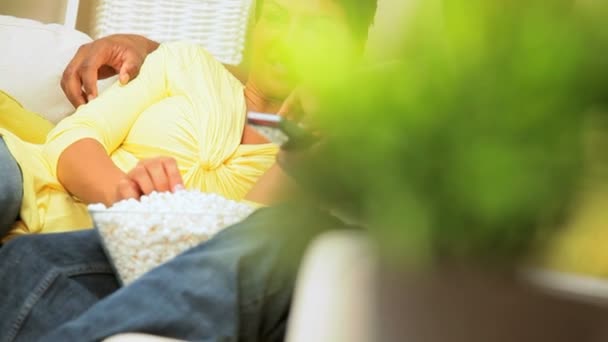 Attractive Ethnic Couple Relaxing with Popcorn & TV — Stock Video