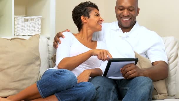 Attractive Ethnic Couple Using Wireless Tablet — Stock Video