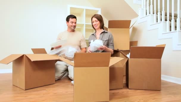 Attractive Couple Surrounded by Moving Boxes — Stock Video