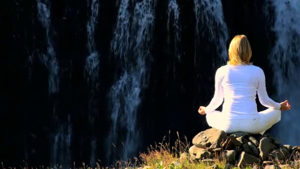 Female Practising Yoga by Waterfall — Stock Video