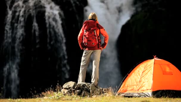 Female Hiker by Tent at Waterfall — Stock Video