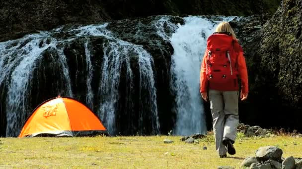 Young Hiker by Tent at Waterfall — Stock Video