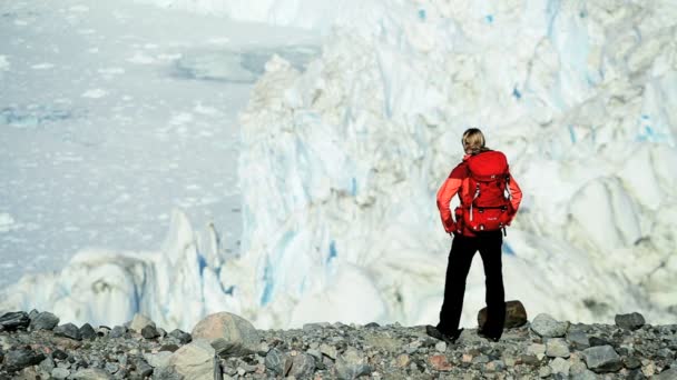 Lone Female on Hiking Expedition by a Glacier — Stock Video