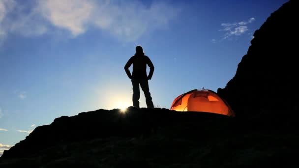 Female Hiker in Silhouette on Mountainside at Daybreak — Stock Video