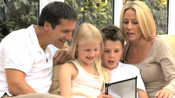 Young Family with Wireless Tablet in Home Setting — Stock Video