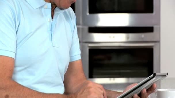 Mature Caucasian Male Using Wireless Tablet — Stock Video