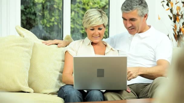 Mature Couple Using Home Laptop — Stock Video