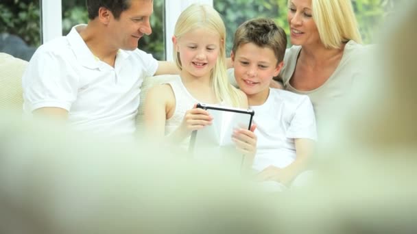 Young Family with Wireless Tablet in Home Setting — Stock Video