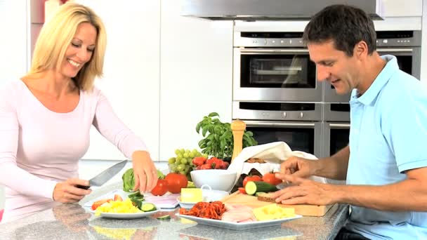 Caucasian Couple in Home Kitchen Preparing Lunch — Stock Video