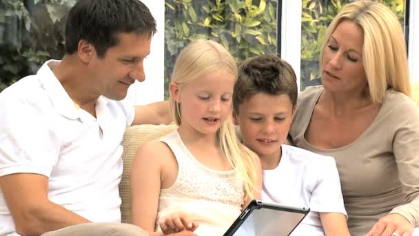 Young Family with Wireless Tablet in Home Setting — Stock Video